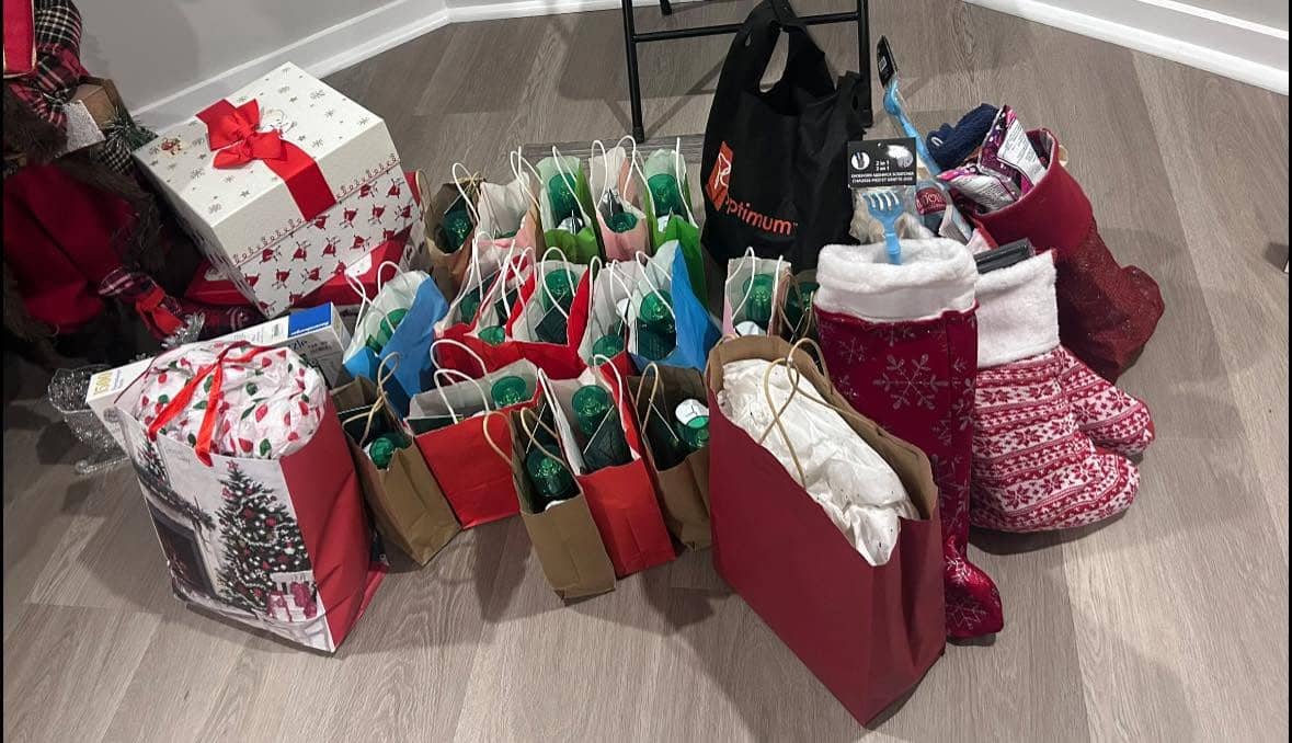 Filled stockings and gift bags staged on the floor ready to go out